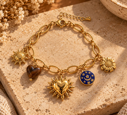 Bracelet MENTON doré avec soleil, cœurs, lune et fleur
